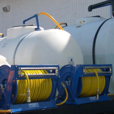 Multiple tank, multiple reel landscape sprayer.  I believe they used the 3 tanks for fertilizer, preemergent, post-emergent.